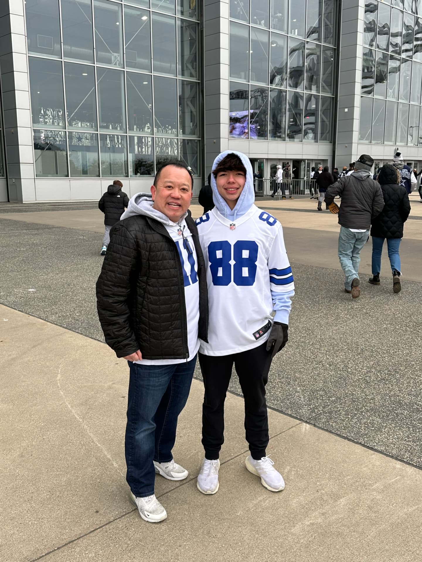 David Nguyen and his son outside AT&T Stadium in Arlington before a Dallas Cowboys game