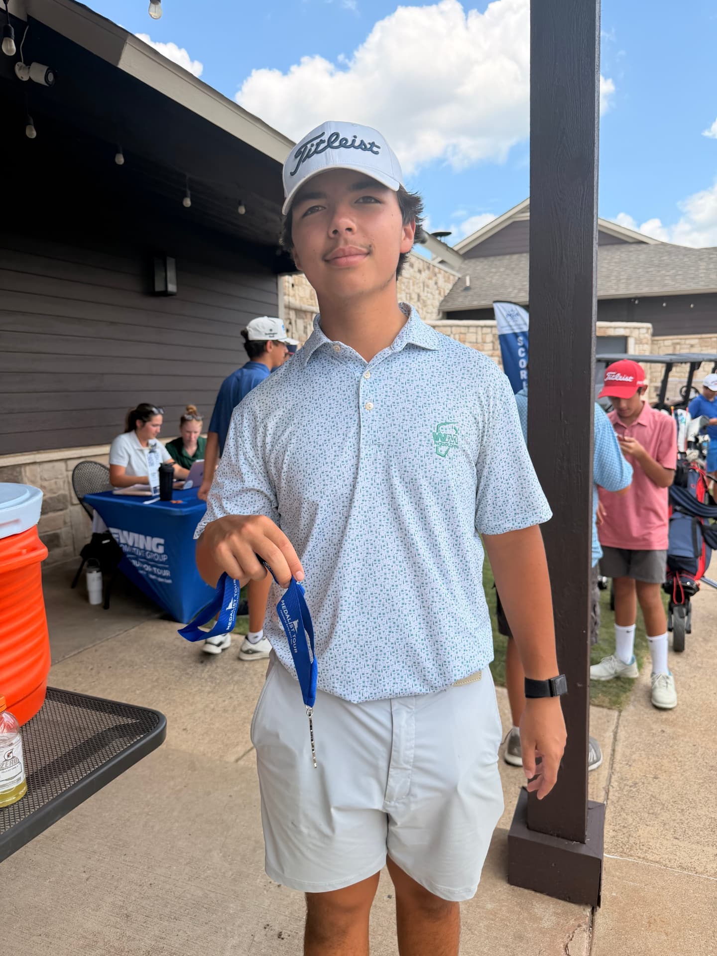 David's son Hunter with a junior golf tournament medal